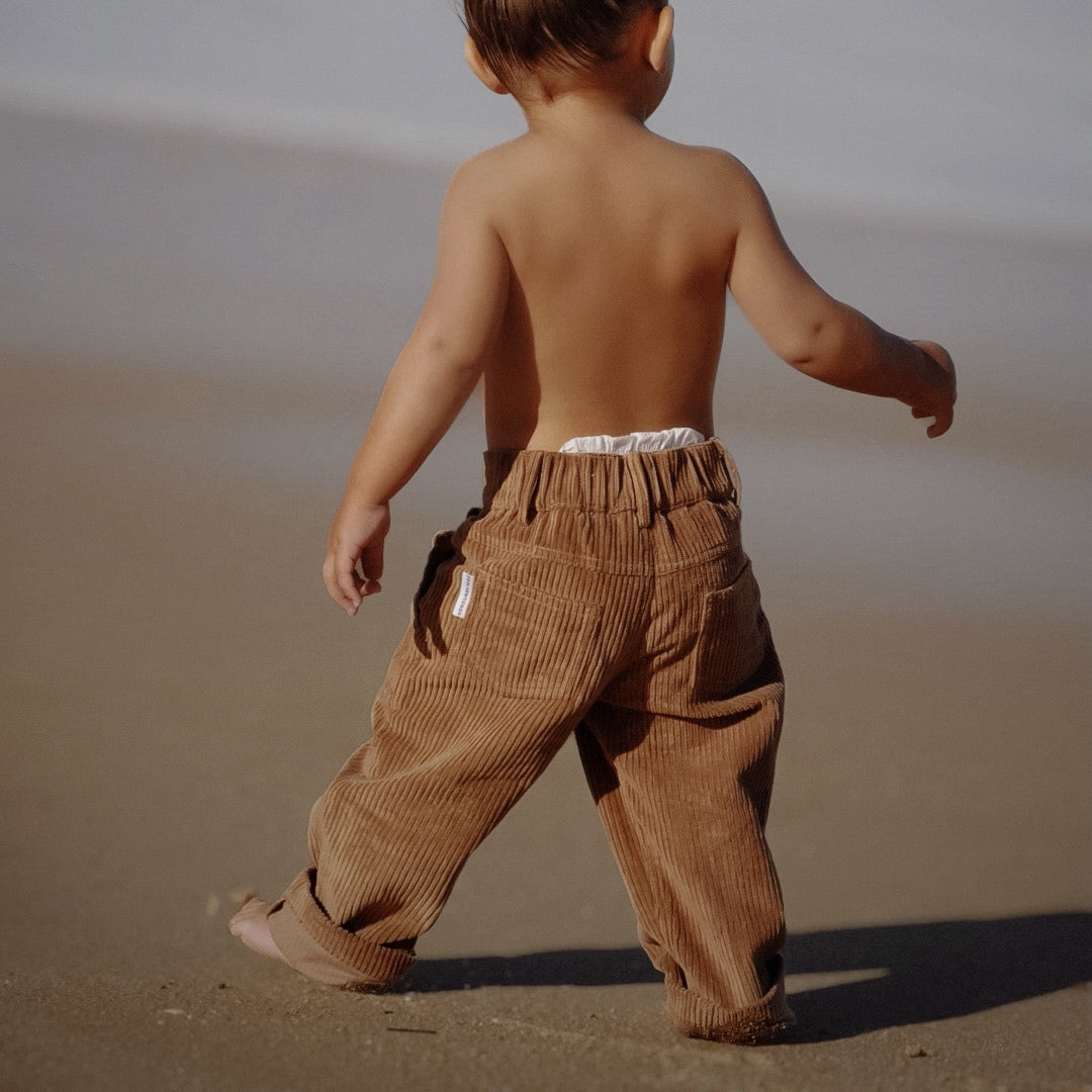 organic cotton corduroy pants in colour tan for infants, toddlers and kids side view