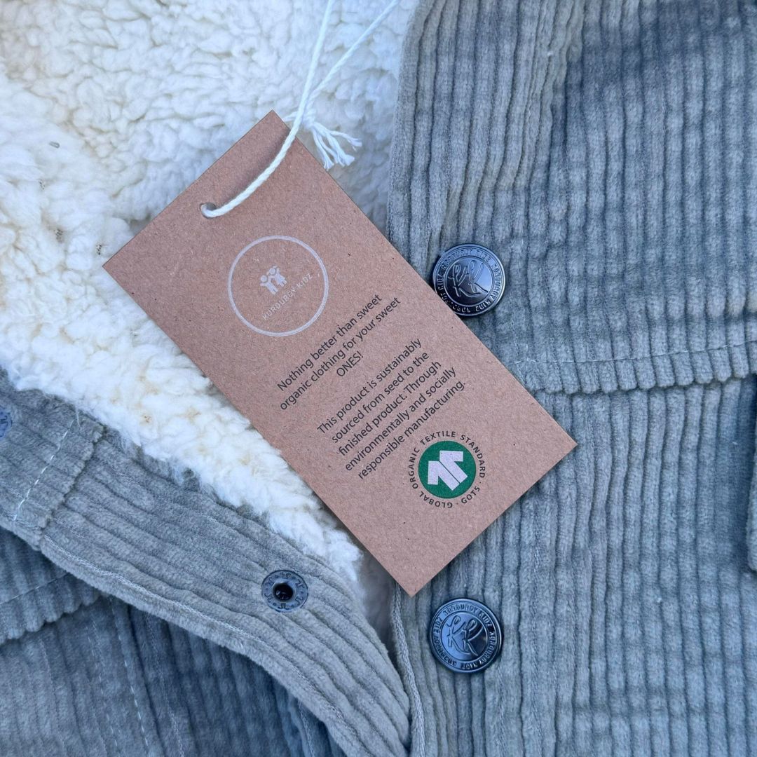 korduroy kidz button with GOTS Certified hang tag