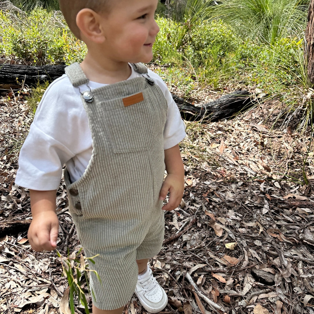 short leg overall, dungaree in colour sage made from organic cotton corduroy clothing for infants, toddlers and kids